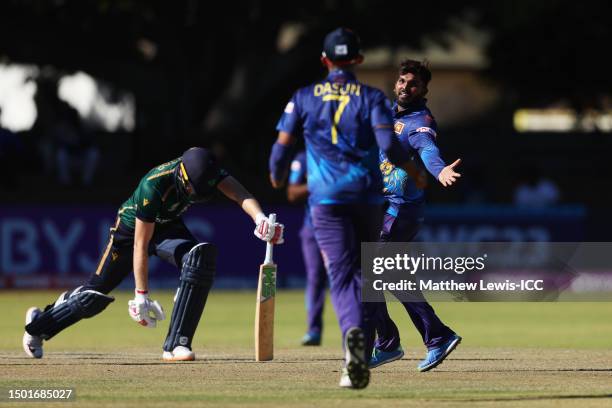 Wanindu Hasaranga of Sri Lanka celebrates towards teammate Dasun Shanaka after dismissing Harry Tector of Ireland by lbw during the ICC Men's Cricket...