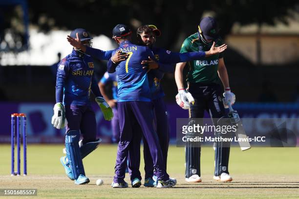 Wanindu Hasaranga of Sri Lanka celebrates with teammate Dasun Shanaka after dismissing Harry Tector of Ireland by lbw during the ICC Men's Cricket...