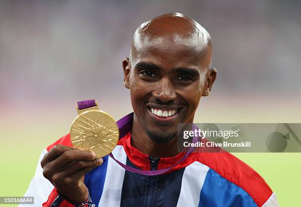 Gold medalist Mohamed Farah of Great Britain poses on the podium during the medal ceremony for the Men's 5000m on Day 15 of the London 2012 Olympic...
