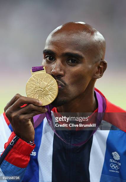 Gold medalist Mohamed Farah of Great Britain poses on the podium during the medal ceremony for the Men's 5000m on Day 15 of the London 2012 Olympic...