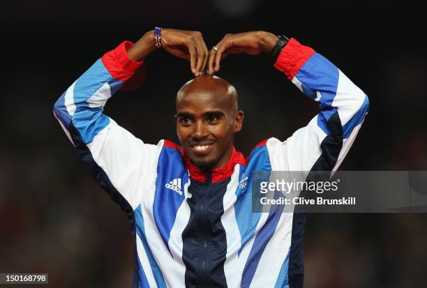 Gold medalist Mohamed Farah of Great Britain celebrates on the podium during the medal ceremony for the Men's 5000m on Day 15 of the London 2012...