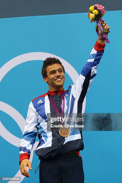 Bronze medallist Tom Daley of Great Britain celebrates on the podium during the medal ceremony for the Men's 10m Platform Diving Semifinal on Day 15...