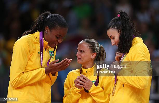 Fabiana Claudino, Fabiana Oliveira and Sheilla Castro of Brazil celebrate after defeating the United States to win the Women's Volleyball gold medal...