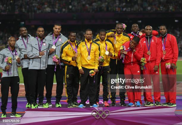 Gold medalists Yohan Blake, Usain Bolt, Nesta Carter and Michael Frater of Jamaica , silver medalists Trell Kimmons, Justin Gatlin, Tyson Gay and...