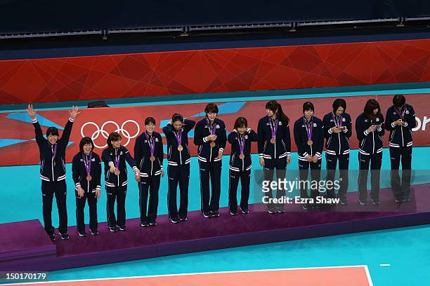Japan stands on the podium with their bronze medals after the Women's Volleyball gold medal match on Day 15 of the London 2012 Olympic Games at Earls...