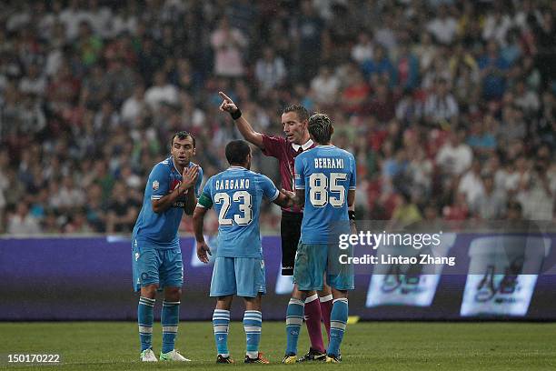 Referee Paolo Mazzoleni sends off Walter Gargano during the Italian Super Cup 2012 match at China's National Stadium on August 11, 2012 in Beijing,...