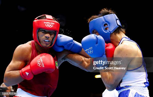 Ryota Murata of Japan exchanges punches with Esquiva Falcao Florentino of Brazil during the Men's Middle Boxing final bout on Day 15 of the London...