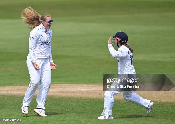 England fielder Tammy Beaumont celebrates with Sophire Ecclestone after she had bowled Jess Joanssen during day four of the LV= Insurance Women's...