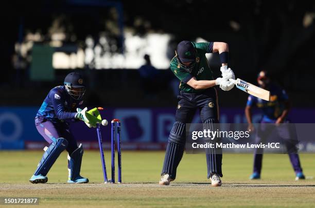 Gareth Delany of Ireland is bowled by Wanindu Hasaranga of Sri Lanka during the ICC Men's Cricket World Cup Qualifier Zimbabwe 2023 match between the...