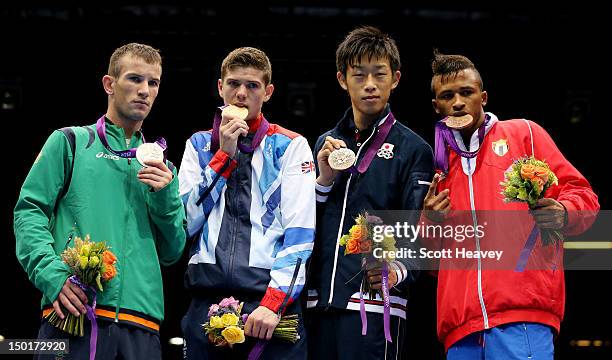 Silver medalist John Joe Nevin of Ireland, gold medalist Luke Campbell of Great Britain, bronze medalist Satoshi Shimizu of Japan and bronze medalist...