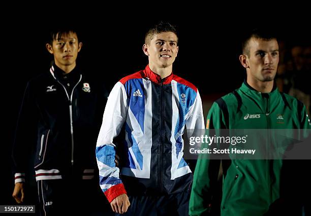 Silver medalist John Joe Nevin of Ireland, gold medalist Luke Campbell of Great Britain and bronze medalist Satoshi Shimizu of Japan walk to the...