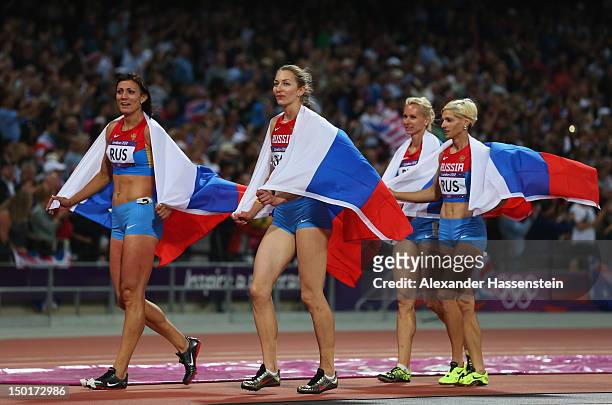 Natalya Antyukh, Tatyana Firova, Yulia Gushchina and Antonina Krivoshapka of Russia celebrate winning silver in the Women's 4 x 400m Relay Final on...