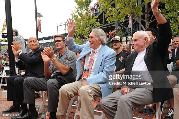 Former Baltimore Orioles Cal Ripken Jr.,Jim Palmer, Brooks Robinson and Earl Weaver attend the unveiling of Eddie Murray's bronze sculpture in the...