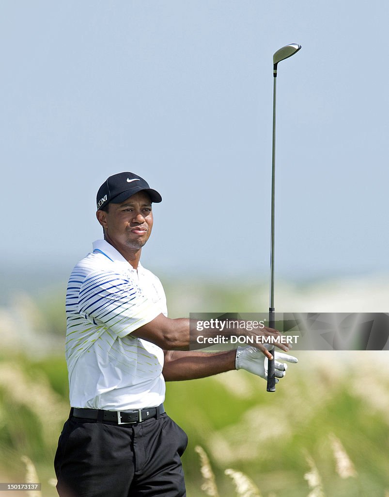 Tiger Woods of the US watches his shot o