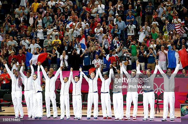Silver medalists France wave from the podium after the Women's Basketball Gold Medal game on Day 15 of the London 2012 Olympic Games at North...