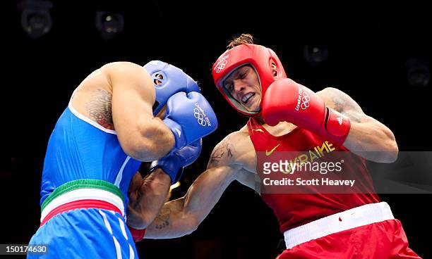 Oleksandr Usyk of Ukraine punches Clemente Russo of Italy during the Men's Heavy Boxing final bout on Day 15 of the London 2012 Olympic Games at...