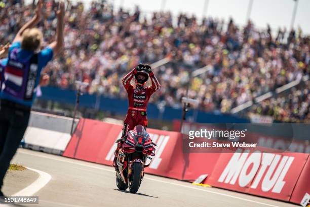 Francesco Bagnaia of Italy and Ducati Lenovo Team stands on his rolling bike during the Race of the MotoGP Motul TT Assen at TT Circuit Assen on June...