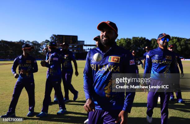 Wanindu Hasaranga of Sri Lanka walks off the field after taking five wickets and winning the ICC Men's Cricket World Cup Qualifier Zimbabwe 2023...