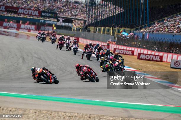 Brad Binder of South Africa and Red Bull KTM Factory Racing leads in front of Francesco Bagnaia of Italy and Ducati Lenovo Team during the Race of...