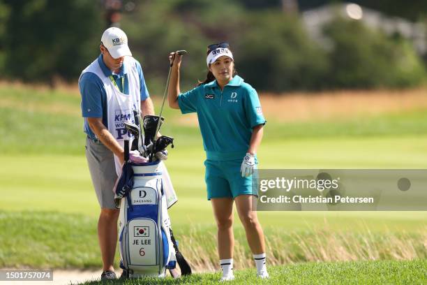 Jeongeun Lee6 of South Korea selects a club on the second fairway during the final round of the KPMG Women's PGA Championship at Baltusrol Golf Club...