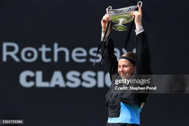 Jelena Ostapenko of Latvia holds the Maud Watson Trophy after winning against Barbora Krejcikova of Czech Republic in the Women's Singles Final...