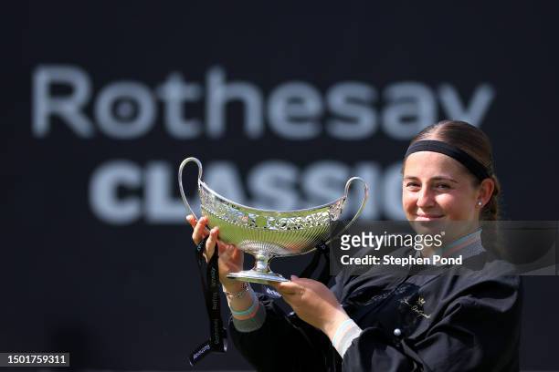 Jelena Ostapenko of Latvia holds the Maud Watson Trophy after winning against Barbora Krejcikova of Czech Republic in the Women's Singles Final...