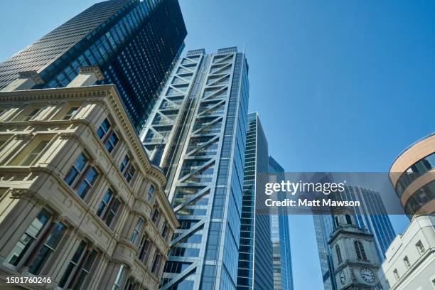 low angle view looking up a glass and steel office building in the city of london england uk. - heron tower stock pictures, royalty-free photos & images