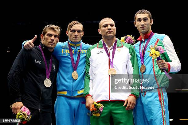 Silver medalist Clemente Russo of Italy, gold medalist Oleksandr Gvozdyk of Ukraine, bronze medalist Tervel Pulev of Bulgaria and bronze medalist...