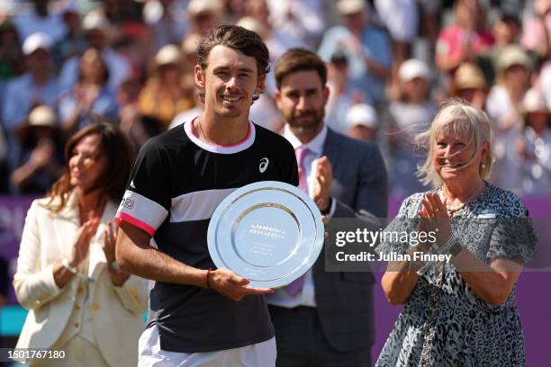 Alex De Minaur of Australia poses with his runners-up trophy after defeat to Carlos Alcaraz of Spain in the Men's Singles Final match on Day Seven of...