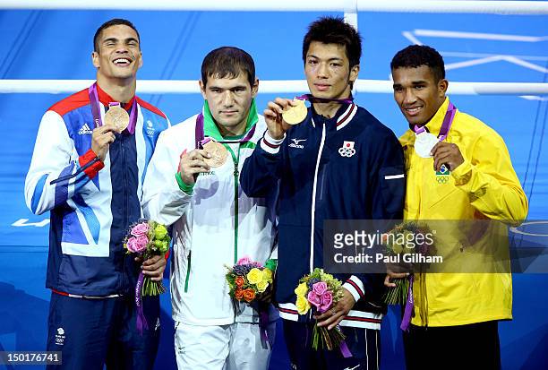 Silver medalist Esquiva Falcao Florentino of Brazil, gold medalist Ryota Murata of Japan, bronze medalist Abbos Atoev of Uzbekistan and bronze...
