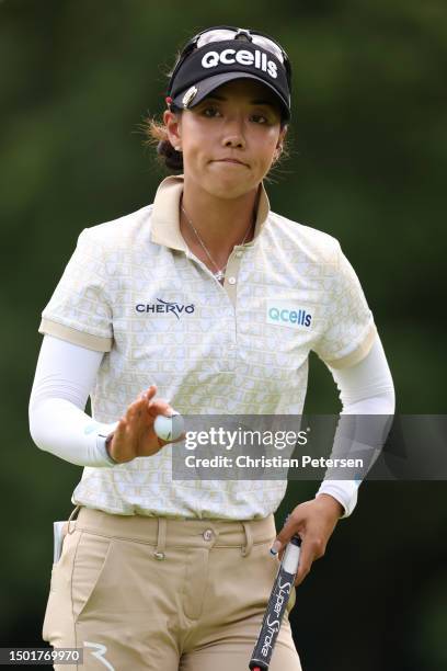 Jenny Shin of South Korea acknowledges fans after a putt on the second green during the final round of the KPMG Women's PGA Championship at Baltusrol...