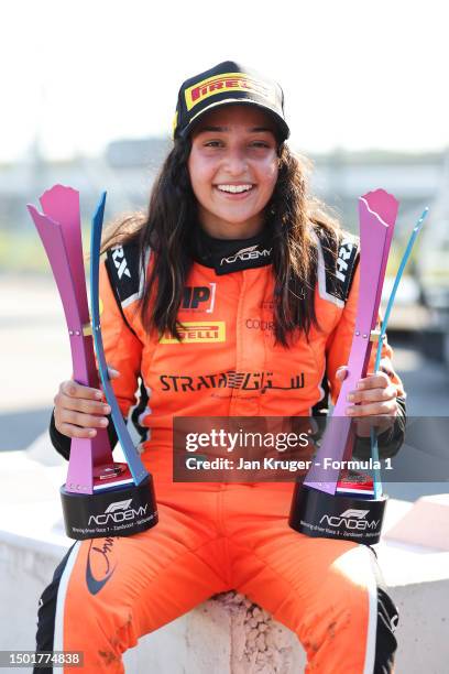 Race winner Hamda Al Qubaisi of United Arab Emirates and MP Motorsport poses for a photo with their trophies after race three of the F1 Academy...