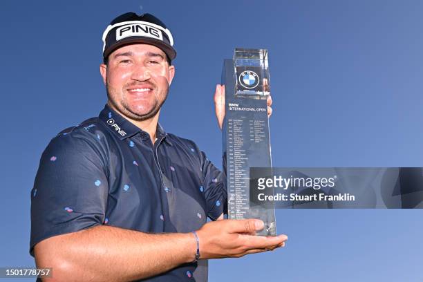 Thriston Lawrence of South Africa poses for a photograph with the trophy following victory during Day Four of the BMW International Open at Golfclub...