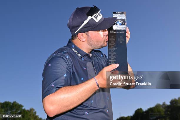 Thriston Lawrence of South Africa poses for a photograph with the trophy following victory during Day Four of the BMW International Open at Golfclub...