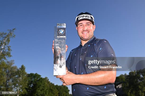 Thriston Lawrence of South Africa poses for a photograph with the trophy following victory during Day Four of the BMW International Open at Golfclub...