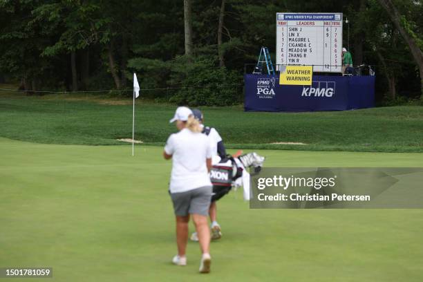 Ashleigh Buhai of South Africa walks off the 13th green due to a weather suspension during the final round of the KPMG Women's PGA Championship at...