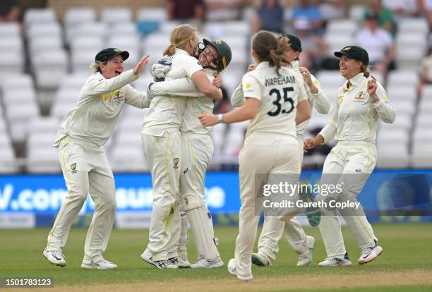 Australia wicketkeeper Alyssa Healy celebrates with Kim Garth after the wicket of Sophia Dunkley of England during day four of the LV= Insurance...