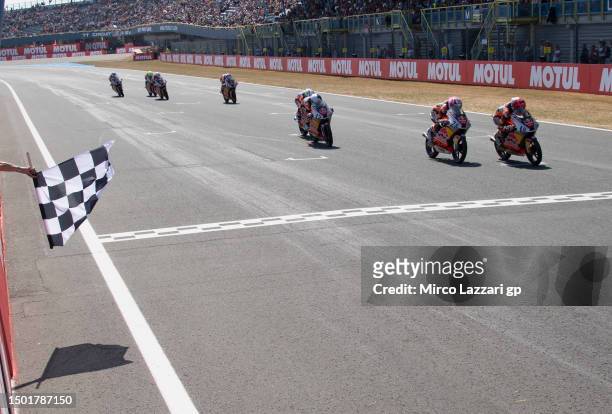 Angel Piqueras of Spain cuts the finish lane and celebrates the victory during the Red Bull MotoGP Rookies Cup 2023 race 2 during the MotoGP of...