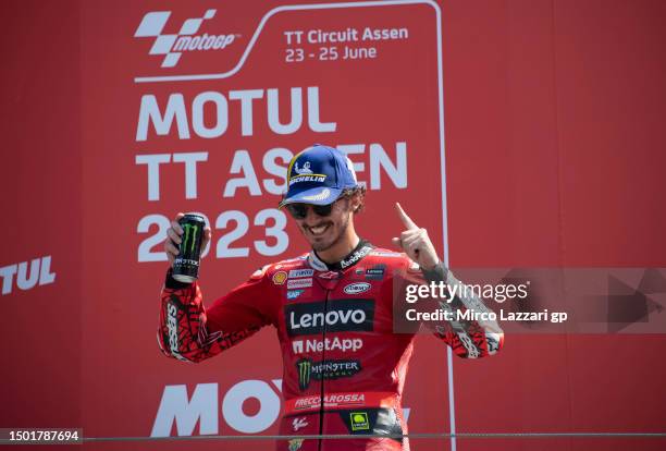 Francesco Bagnaia of Italy and Ducati Lenovo Team celebrates the victory on the podium at the end of the MotoGP race during the MotoGP of Netherlands...