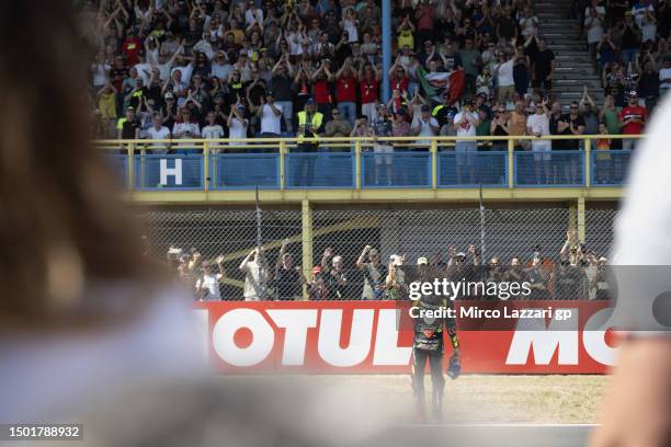 Marco Bezzecchi of Italy and Mooney VR46 Racing Team celebrates the second place in front of fans at the end of the MotoGP race during the MotoGP of...