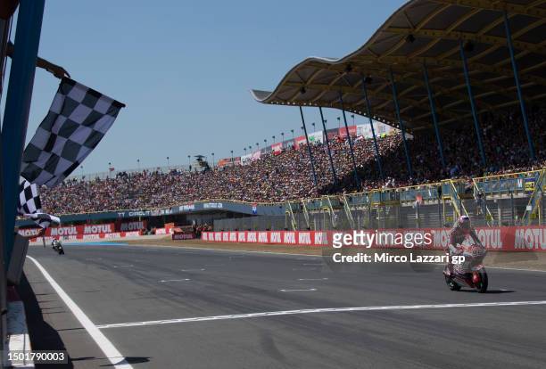 Jake Dixon of Great Britain and GasGas Aspar Team cuts the finish lane and celebrates the victory during the Moto2 race during the MotoGP of...