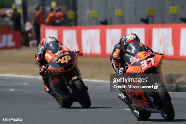 Pedro Acosta of Spain and Red Bull KTM Ajo leads Aron Canet of Spain and Pons Wagon LOS40 during the Moto2 race during the MotoGP of Netherlands -...