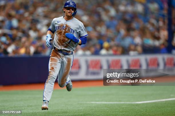 Bobby Witt Jr. #7 of the Kansas City Royals rounds third base and scores on a rbi single from Maikel Garcia against the Tampa Bay Rays during the...