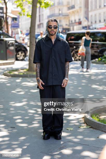 Rauw Alejandro is seen outside Sacai during the Menswear Spring Summer 2024 as part of Paris Fashion Week on June 25, 2023 in Paris, France.