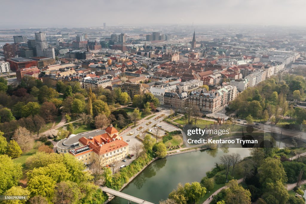 Aerial view of a large green park in the middle of a big city.