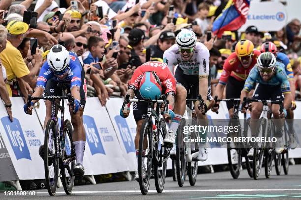 Alpecin-Deceuninck's Belgian rider Jasper Philipsen sprints to the finish line ahead of Lotto Dstny's Australian rider Caleb Ewan , Bahrain -...