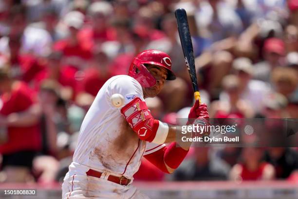 Joey Votto of the Cincinnati Reds ducks to avoid being hit by a pitch in the third inning against the Atlanta Braves at Great American Ball Park on...