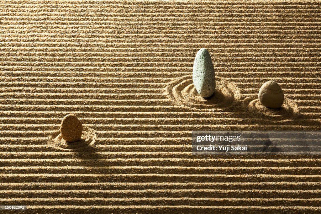 Zen stone on sand