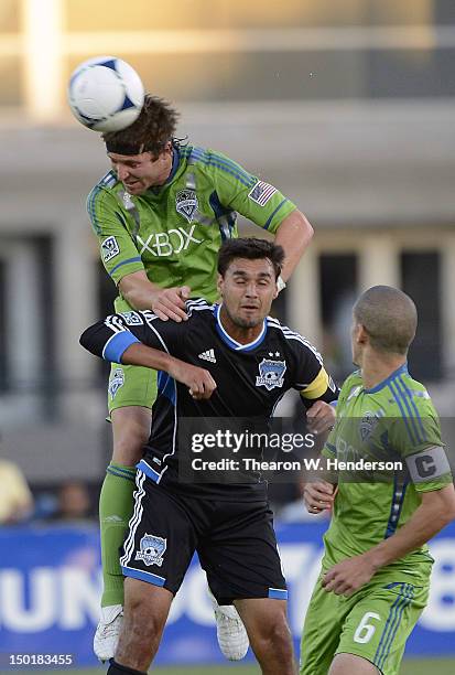 Jeff Parke of the Seattle Sounders goes up to hit a header over Chris Wondolowski of the San Jose Earthquakes during a MLS game at Buck Shaw Stadium...