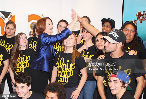 Australian Prime Minister Julia Gillard laughs as she stands with indigenous children after launching the Korin Gamadji Institute at the ME Bank...